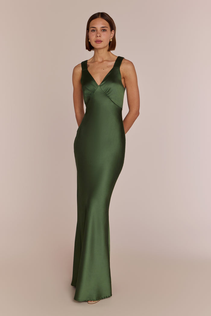 Woman in a long green olive satin bridesmaid dress