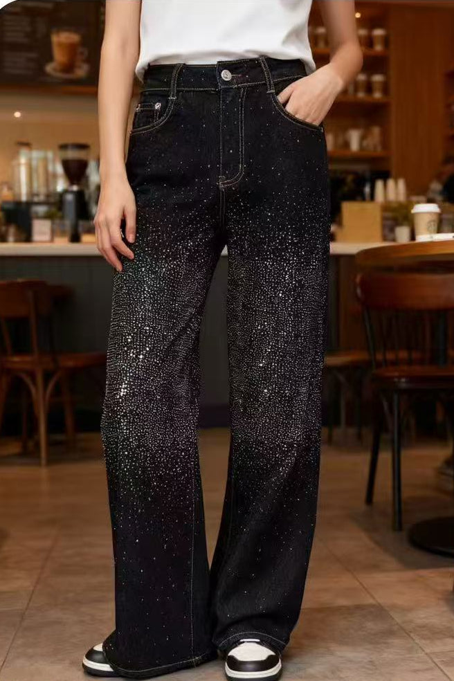 Black high waisted wide leg jeans with crystal embellishment and five-pocket styling.