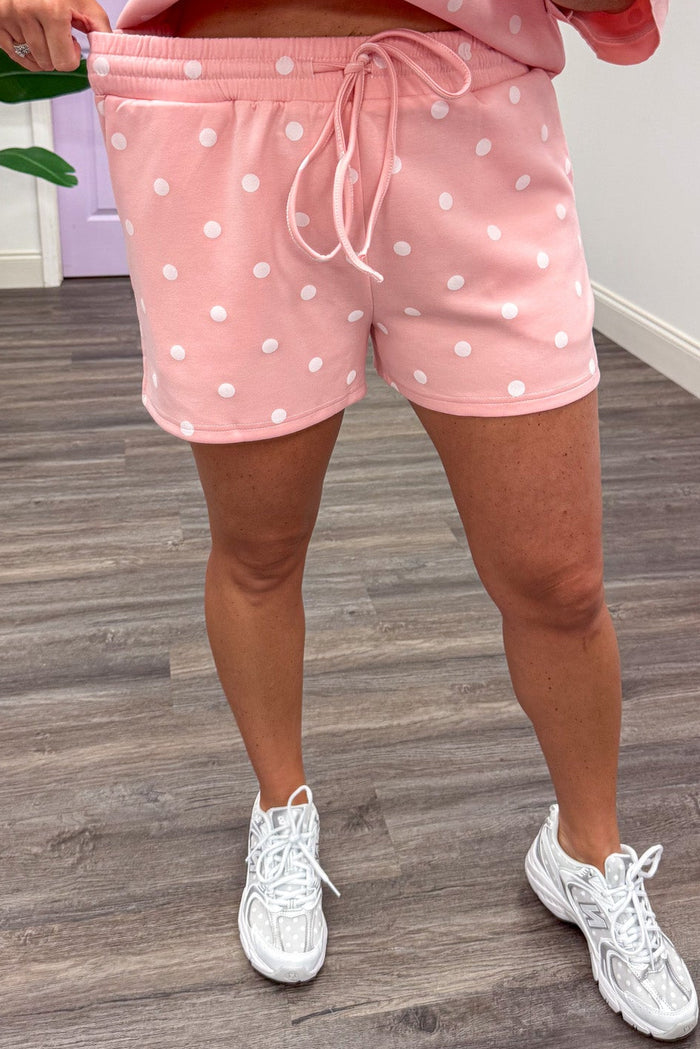light pink with white polka dot print top and elastic waist shorts matching knit athleisure set