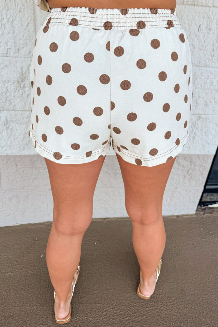 cream with brown polka dot print elastic waistband wide leg denim shorts with reverse stitching details