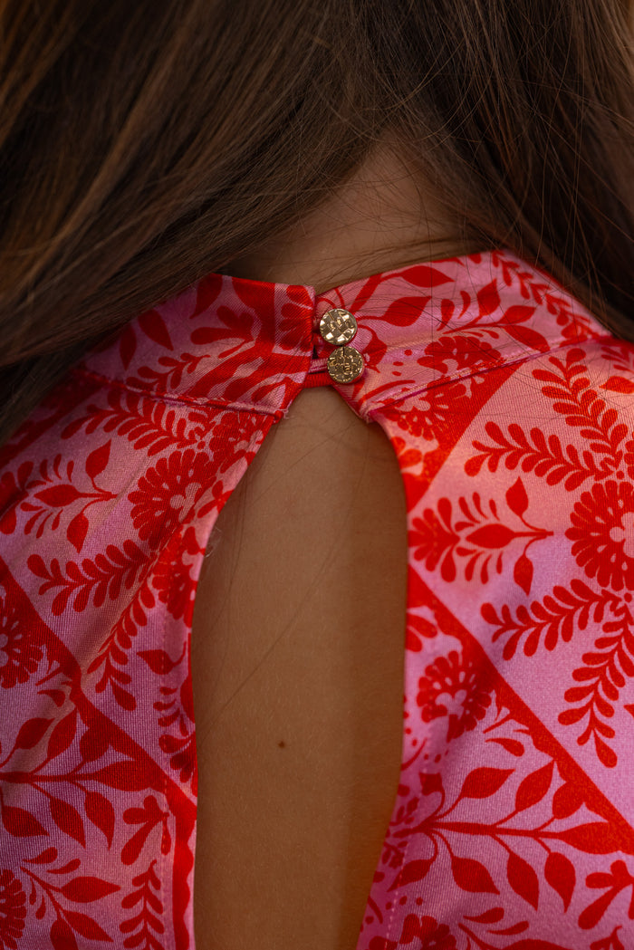Women's pink and red floral print halter maxi dress by Karlie showing up close view of keyhole double button closure