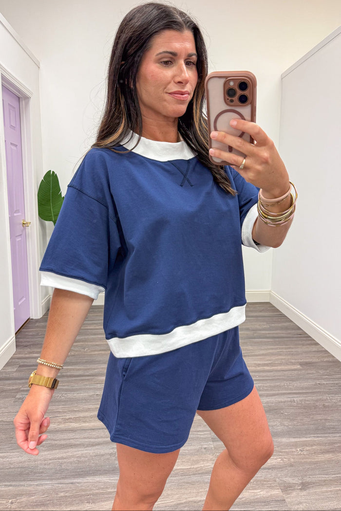 navy blue with white colorblock trim drop shoulder short sleeve crew neckline knit top