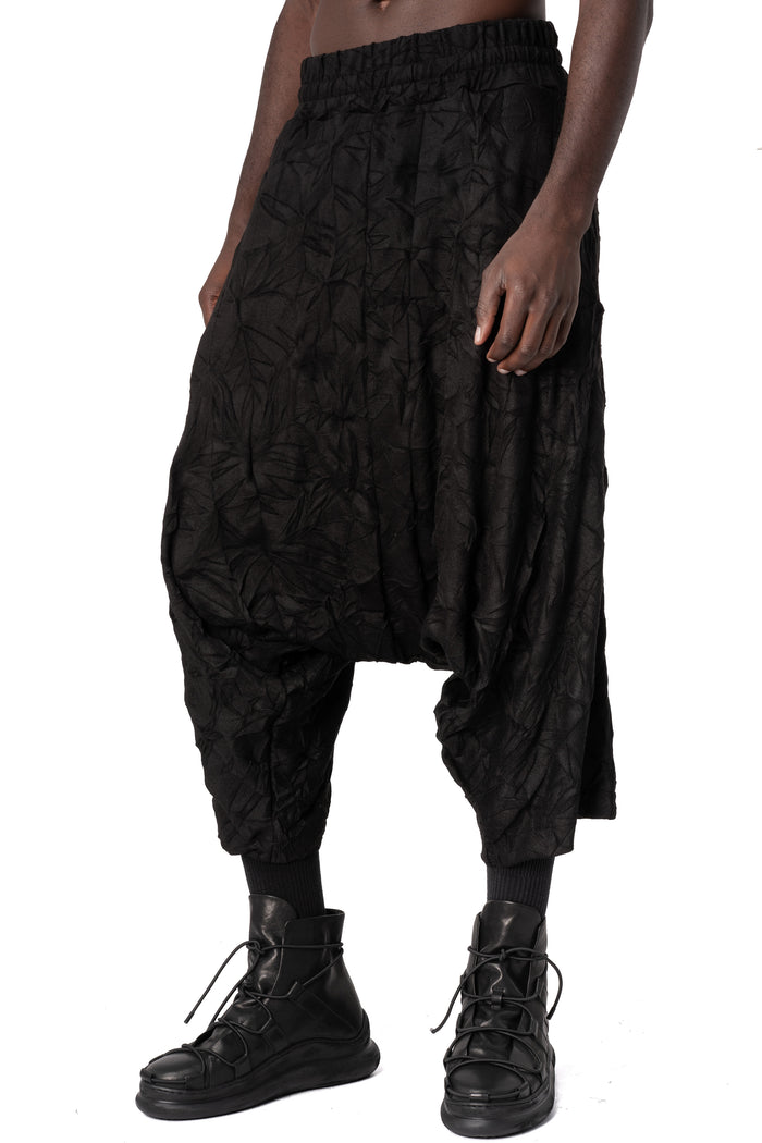 Oversized low-crotch wrinkled jersey trousers