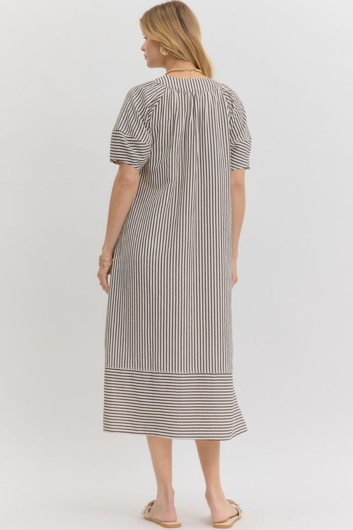 Women's black and white striped fall midi dress, back view