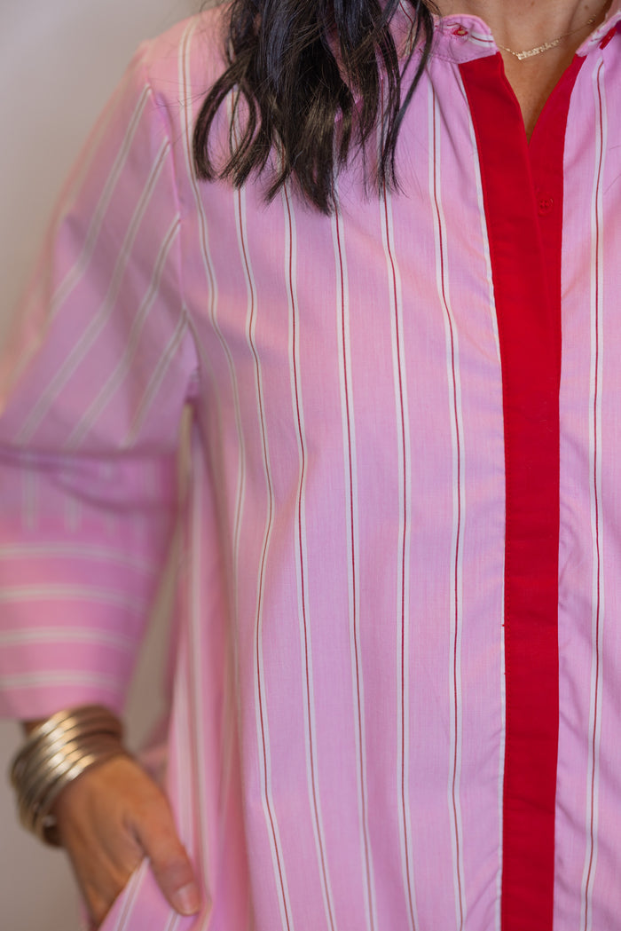 Women's pink and white striped dress by Entro showing hot pink center trim