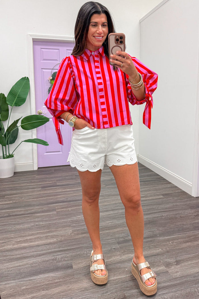 red and pink alternating striped pattern hidden button front poplin top