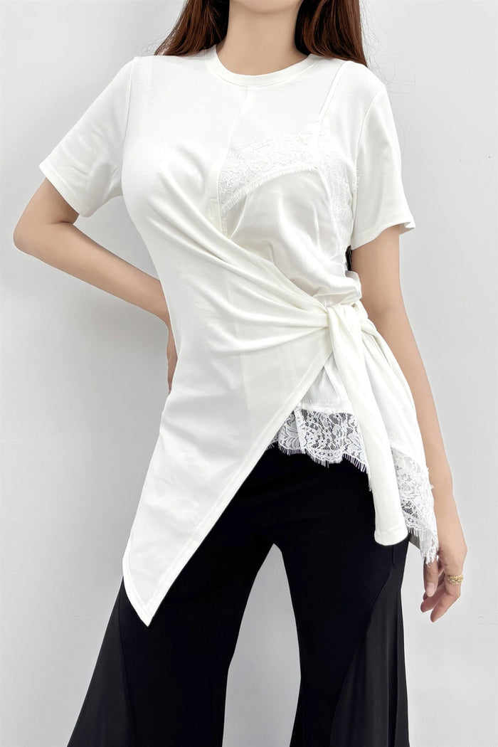 Lemon yellow short sleeve layered wrap top with a white lace inset and asymmetric draped hem.